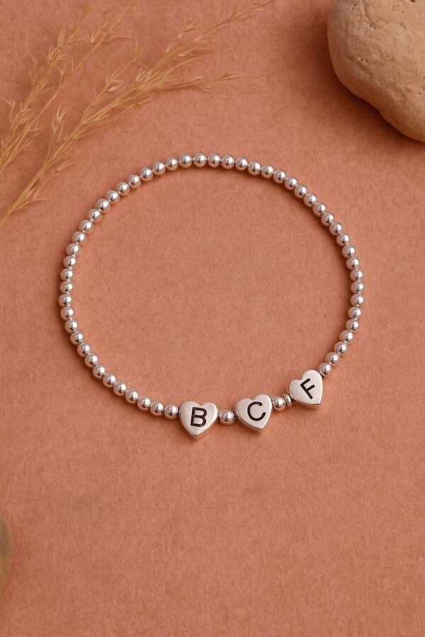 PULSERA ELASTIZADA BOLITAS CON 3 INICIALES